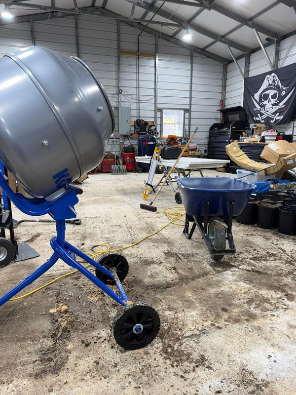 A cement mixer used for blending potting soil in the barn