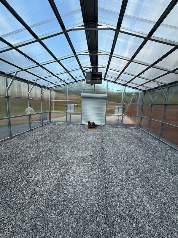 The new greenhouse frame with a gravel floor