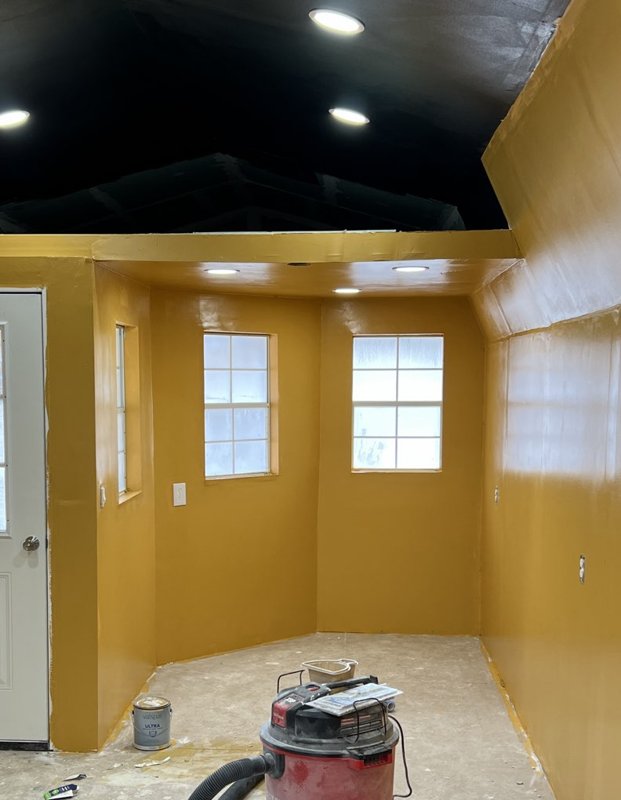 The honey house freshly painted a warm honey gold